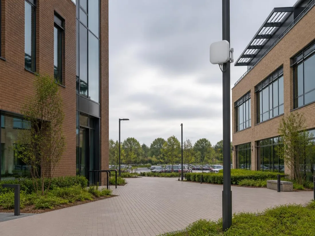 Exterior wireless coverage across a courtyard and parking area