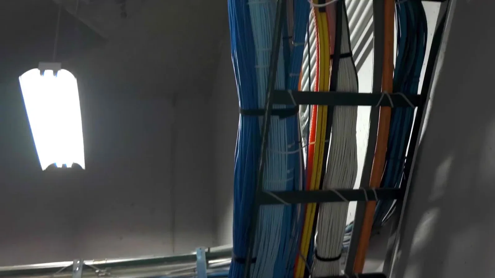 Structured cabling run above a ceiling during an installation