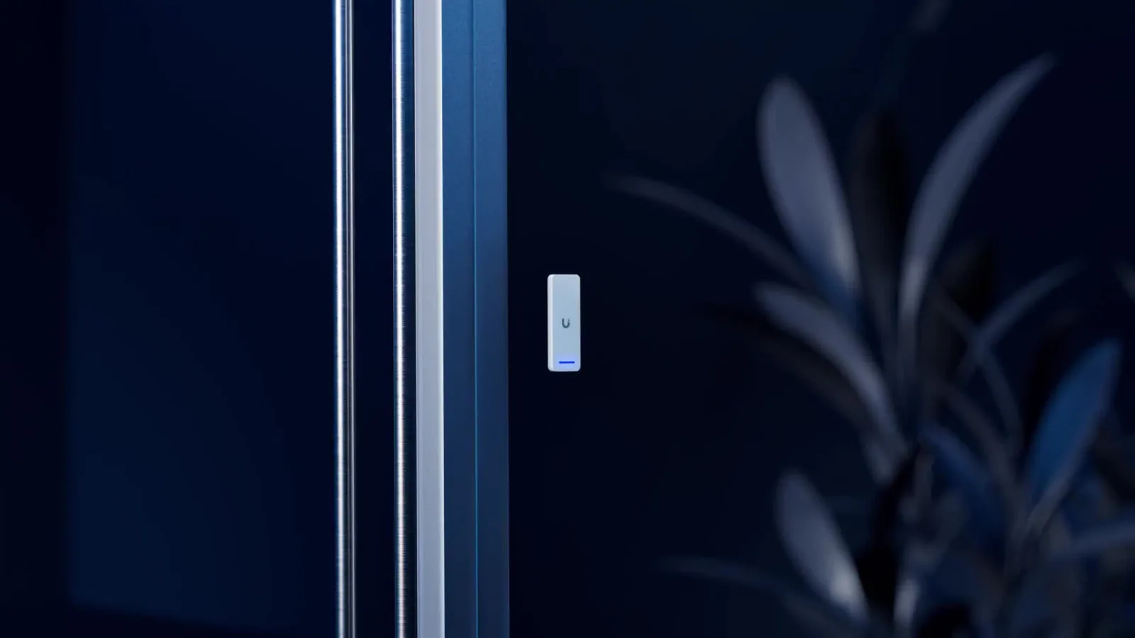UniFi Access reader mounted beside a glass office door
